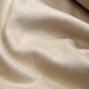 ZEVQ premium faux suede hooded kaftan in beige, a fur-lined maxi festival duster worn at a desert festival.