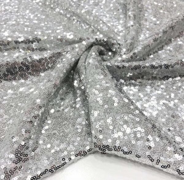 ZEVQ premium silver sequin hooded poncho coat with faux fur hood and cuffs for festival fashion