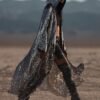 ZEVQ Silver Sequin Hooded Duster custom print maxi coat creating a liquid metal effect at a festival