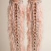 Blush pink faux feather leg warmers with shimmering sequin trim, styled over combat boots for a festival look.