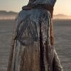 ZEVQ Silver Sequin Hooded Duster custom print maxi coat creating a liquid metal effect at a festival