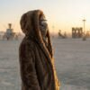 ZEVQ premium brown faux fur hooded festival parka worn at a festival
