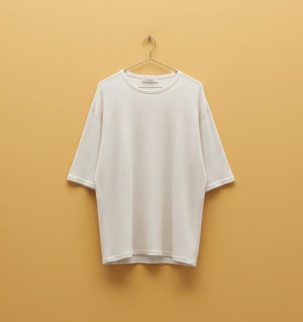 ZEVQ premium oversize boho festival t-shirt in off-white, modeled for desert festival wear.