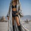 ZEVQ's custom holographic sequin duster, a shimmering festival kimono, worn at a vibrant event.