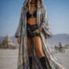 ZEVQ's custom holographic sequin duster, a shimmering festival kimono, worn at a vibrant event.