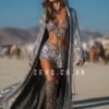 Model wearing the premium silver sequin hooded kaftan and matching shorts festival set at a rave.