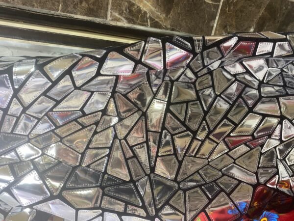 ZEVQ's premium satin-lined mirror mosaic duster, a custom festival robe with reflective panels and luxurious lining.