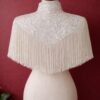 ZEVQ custom sequin bridal cape with beaded fringe, a luxury wedding shrug for brides and performers.