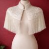 ZEVQ custom sequin bridal cape with beaded fringe, a luxury wedding shrug for brides and performers.