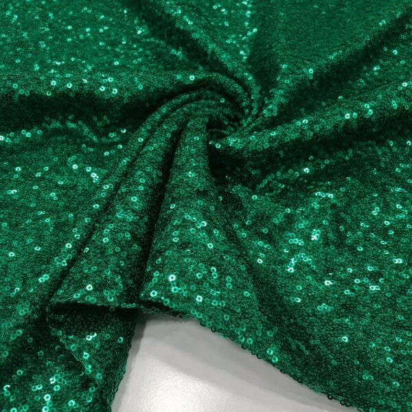 ZEVQ Emerald Green Sequin Hooded Duster Coat flowing in the desert wind at a festival