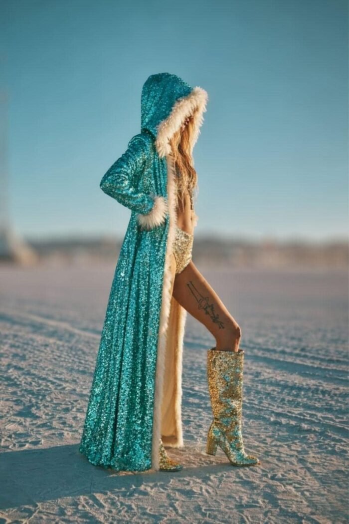 ZEVQ's premium turquoise sequin duster coat with a faux fur hood, a statement piece for festival fashion.