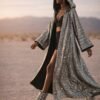 Custom Metallic Mirror Duster Coat in silver with black silk satin lining, worn at a festival