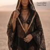 ZEVQ premium black lace hooded kaftan, a sheer festival kimono with gold trim, worn at a desert festival.