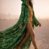 ZEVQ Emerald Green Sequin Hooded Duster Coat flowing in the desert wind at a festival
