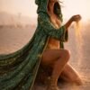 ZEVQ Emerald Green Sequin Hooded Duster Coat flowing in the desert wind at a festival