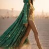 ZEVQ Emerald Green Sequin Hooded Duster Coat flowing in the desert wind at a festival