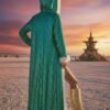 ZEVQ premium emerald sequin festival cloak with dramatic white faux fur trim, worn at a festival.