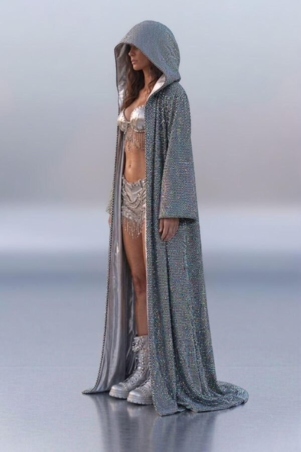 Model wearing a custom holographic silver festival duster kimono at a festival, showcasing its reflective, light-shifting properties.