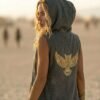 ZEVQ Owl Oracle Black Linen Hooded Duster worn at a festival, showcasing the shamanic back print and flowing silhouette.