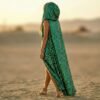 ZEVQ Emerald Green Sequin Hooded Maxi Vest, a premium festival duster worn at a desert rave.