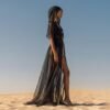 ZEVQ Black Sheer Hooded Chiffon Festival Kaftan with Gold Trim, worn at a desert festival.