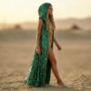 ZEVQ Emerald Green Sequin Hooded Maxi Vest, a premium festival duster worn at a desert rave.