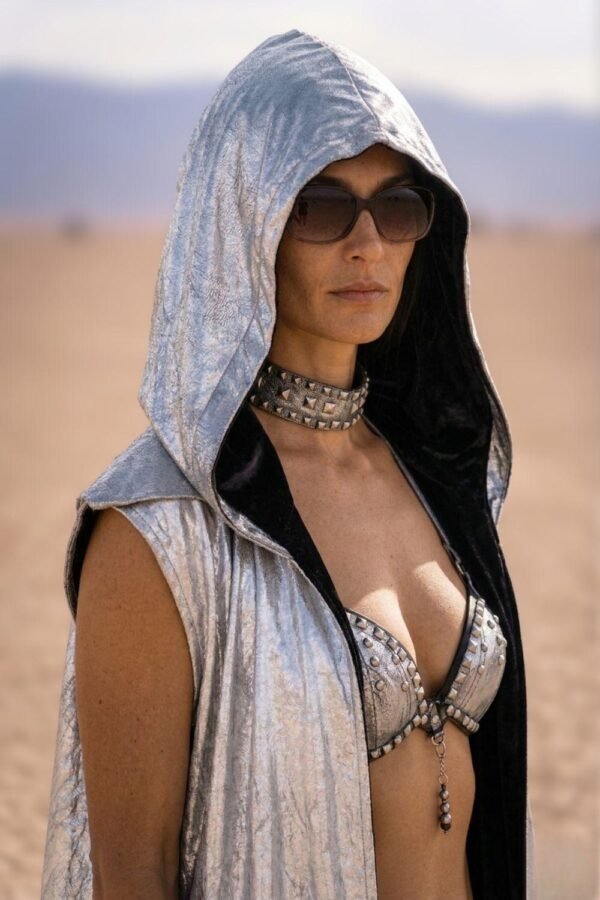 ZEVQ premium metallic silver hooded maxi vest worn at a futuristic festival