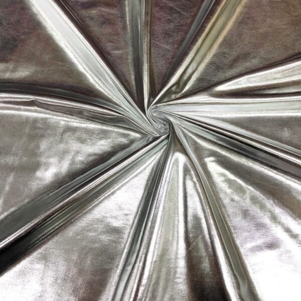 ZEVQ premium metallic silver hooded maxi vest worn at a futuristic festival