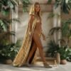 Model wearing the premium Gold Sequin Hooded Maxi Vest, a festival statement duster, at sunset.