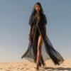 ZEVQ Black Sheer Hooded Chiffon Festival Kaftan with Gold Trim, worn at a desert festival.