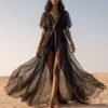 ZEVQ Black Sheer Hooded Chiffon Festival Kaftan with Gold Trim, worn at a desert festival.